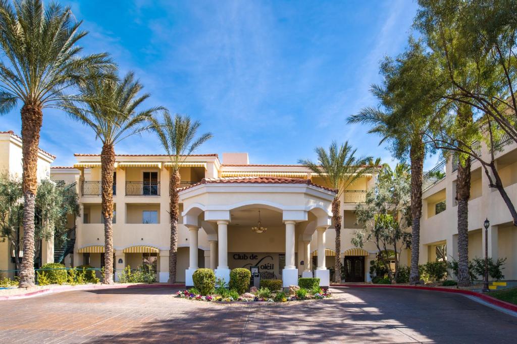 a large building with palm trees and palm trees at Club de Soleil All-Suite Resort in Las Vegas