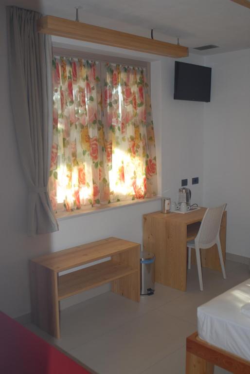 TV a/nebo společenská místnost v ubytování B&B Alciliegio