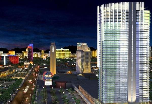 a city skyline at night with a tall building at Palms Place Studio with Balcony & Strip View in Las Vegas