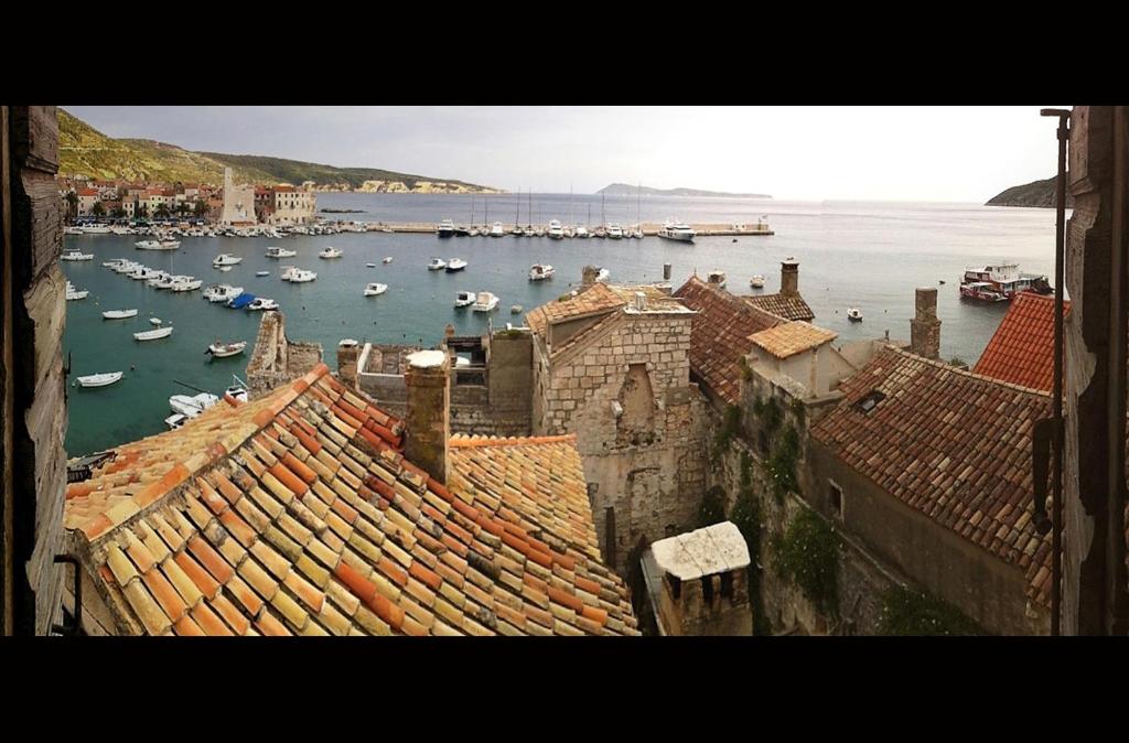 a view of a harbor with boats in the water at Villa Casaviva in Komiža