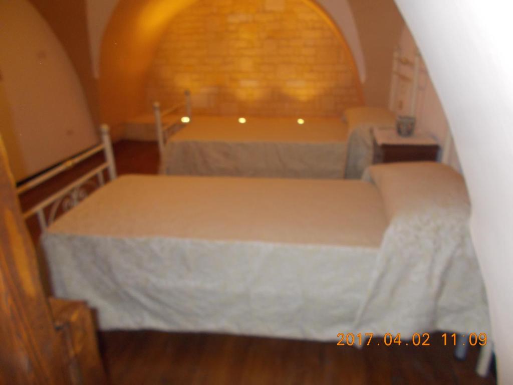 Postel nebo postele na pokoji v ubytování A Casa Di Monia