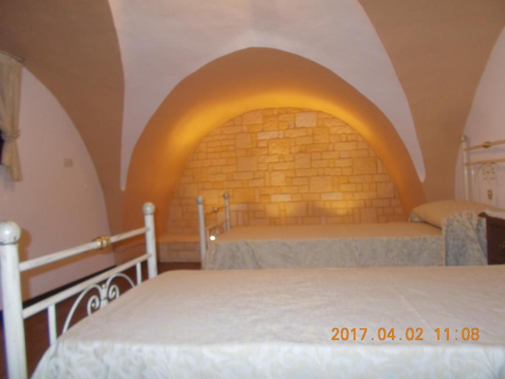 Postel nebo postele na pokoji v ubytování A Casa Di Monia