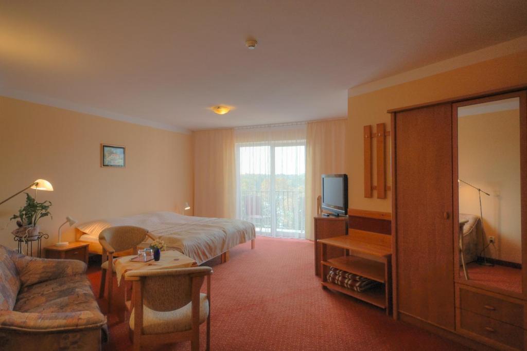 Televízia a/alebo spoločenská miestnosť v ubytovaní Panoramic-Oscar
