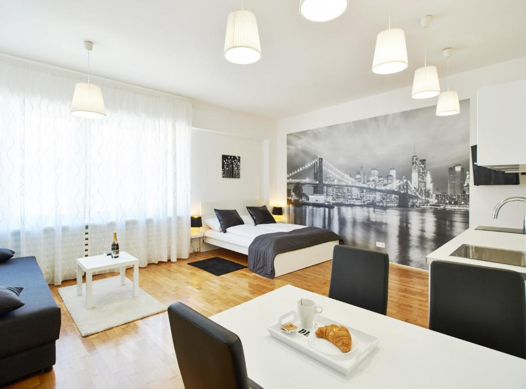 a living room with a bed and a table at Stars of Zagreb Apartments in Zagreb