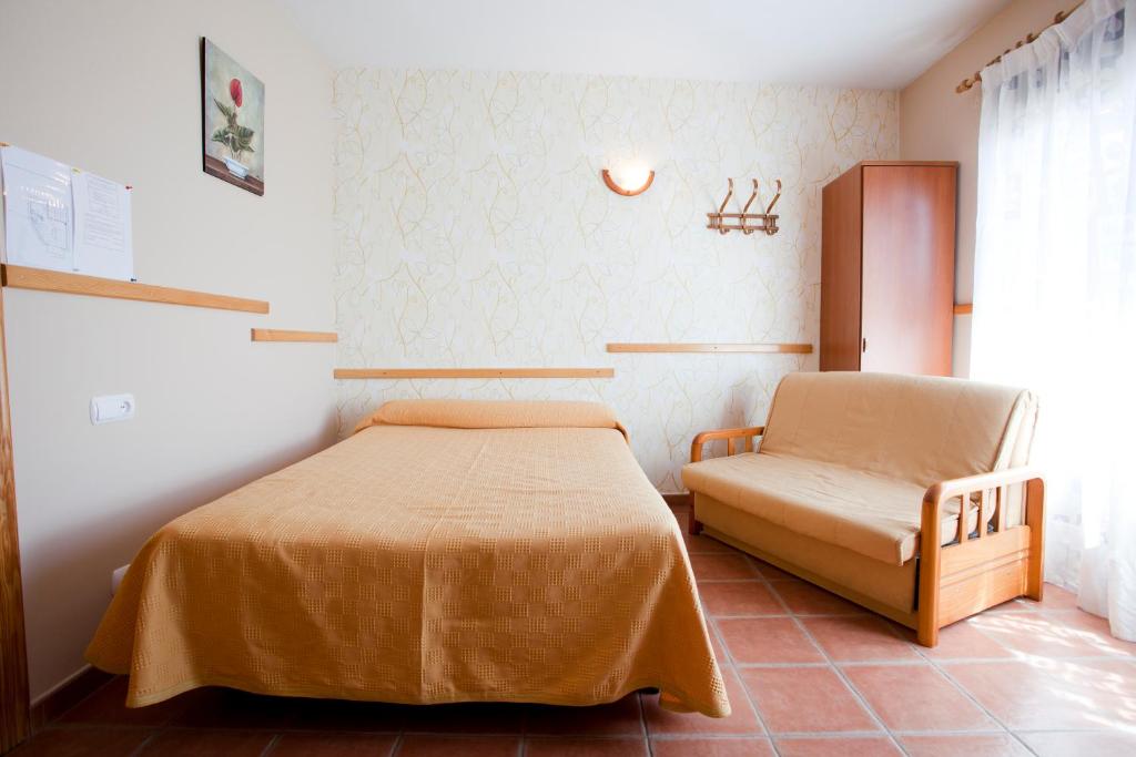 Postel nebo postele na pokoji v ubytování Apartamentos Rurales "La Fuentecilla"