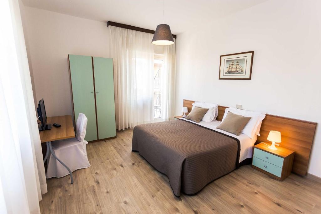 Posteľ alebo postele v izbe v ubytovaní Hotel Antagos