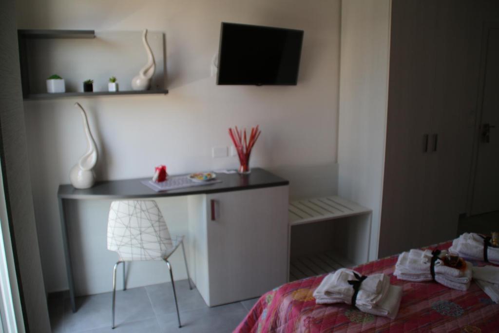 Postel nebo postele na pokoji v ubytování la Terrazza B&B