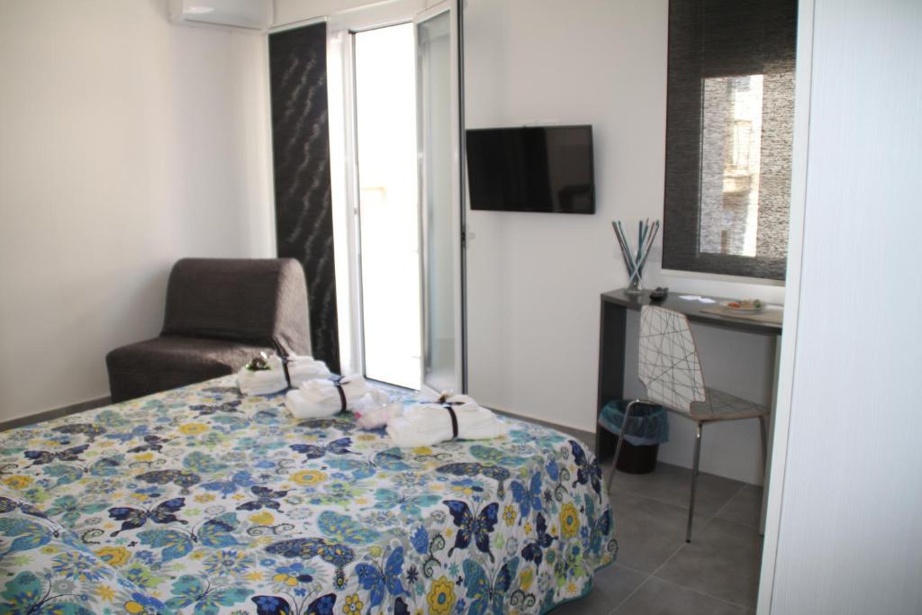 Postel nebo postele na pokoji v ubytování la Terrazza B&B
