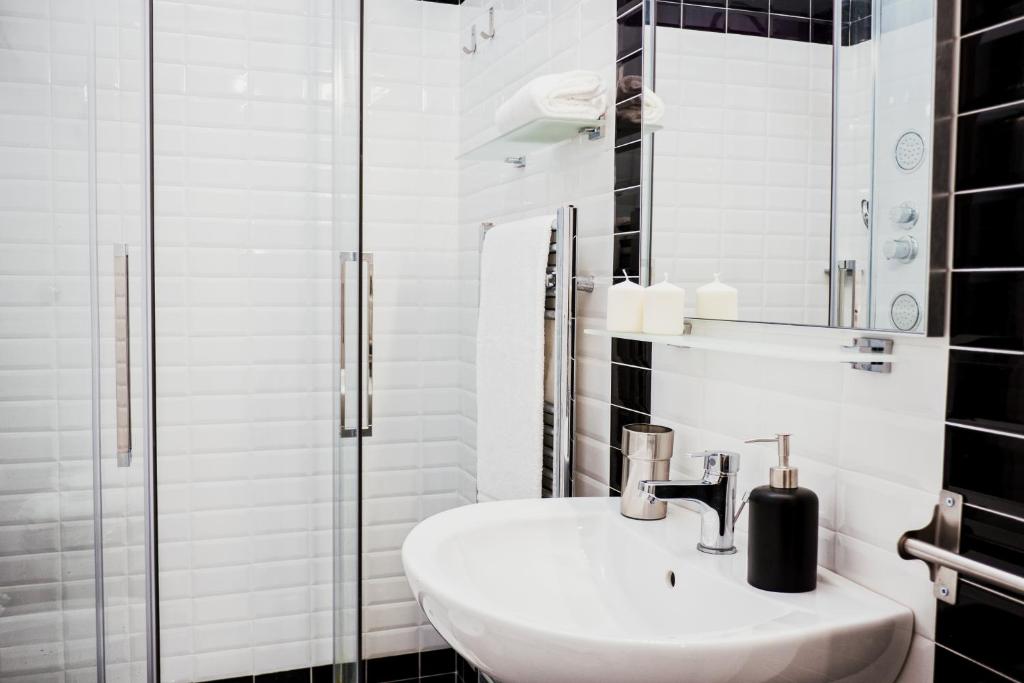 A bathroom at BMGA l Stylish Industrial Termini Apartment
