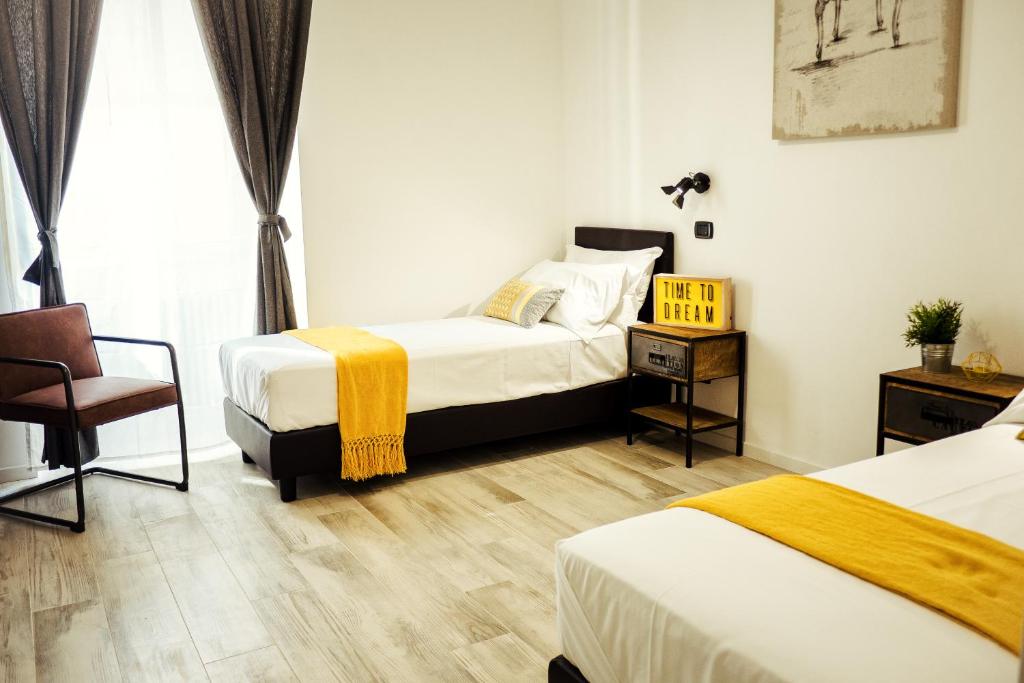 A bed or beds in a room at BMGA l Stylish Industrial Termini Apartment