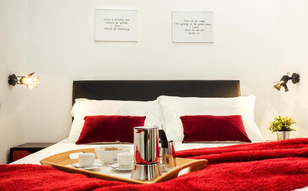 A bed or beds in a room at BMGA l Stylish Industrial Termini Apartment