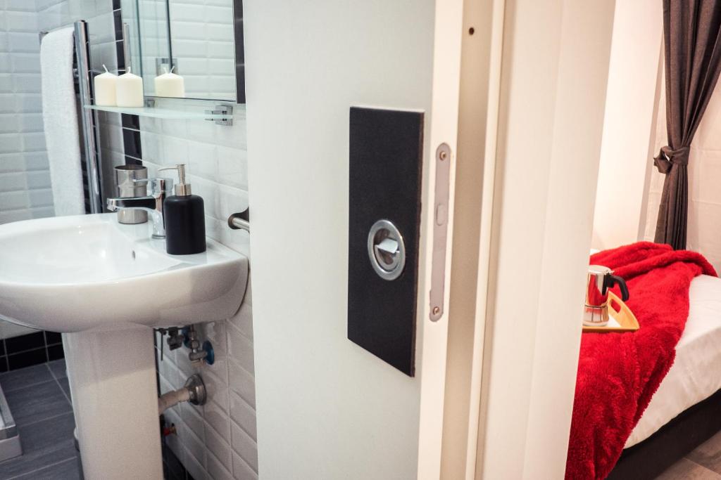 A bathroom at BMGA l Stylish Industrial Termini Apartment