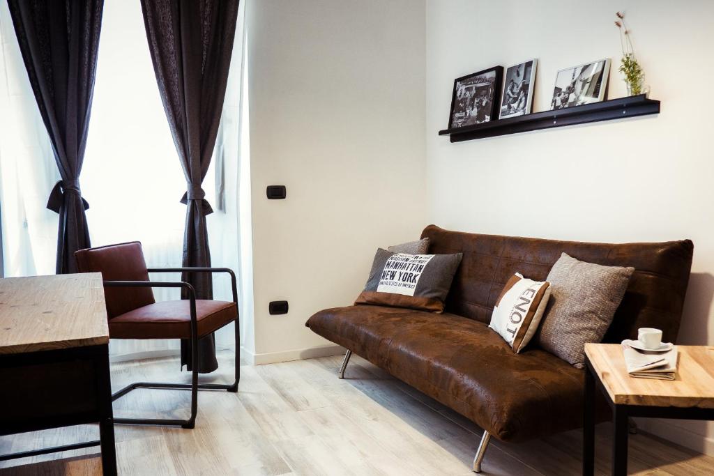 A seating area at BMGA l Stylish Industrial Termini Apartment