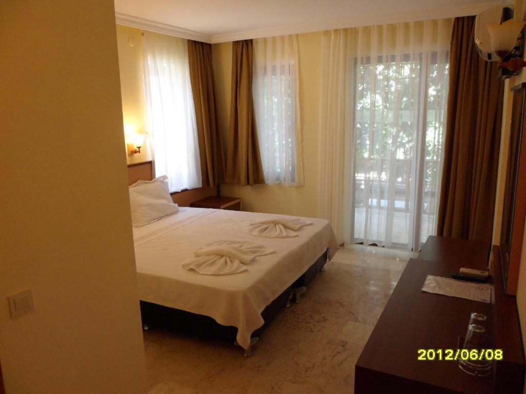 Postel nebo postele na pokoji v ubytování Felice Hotel