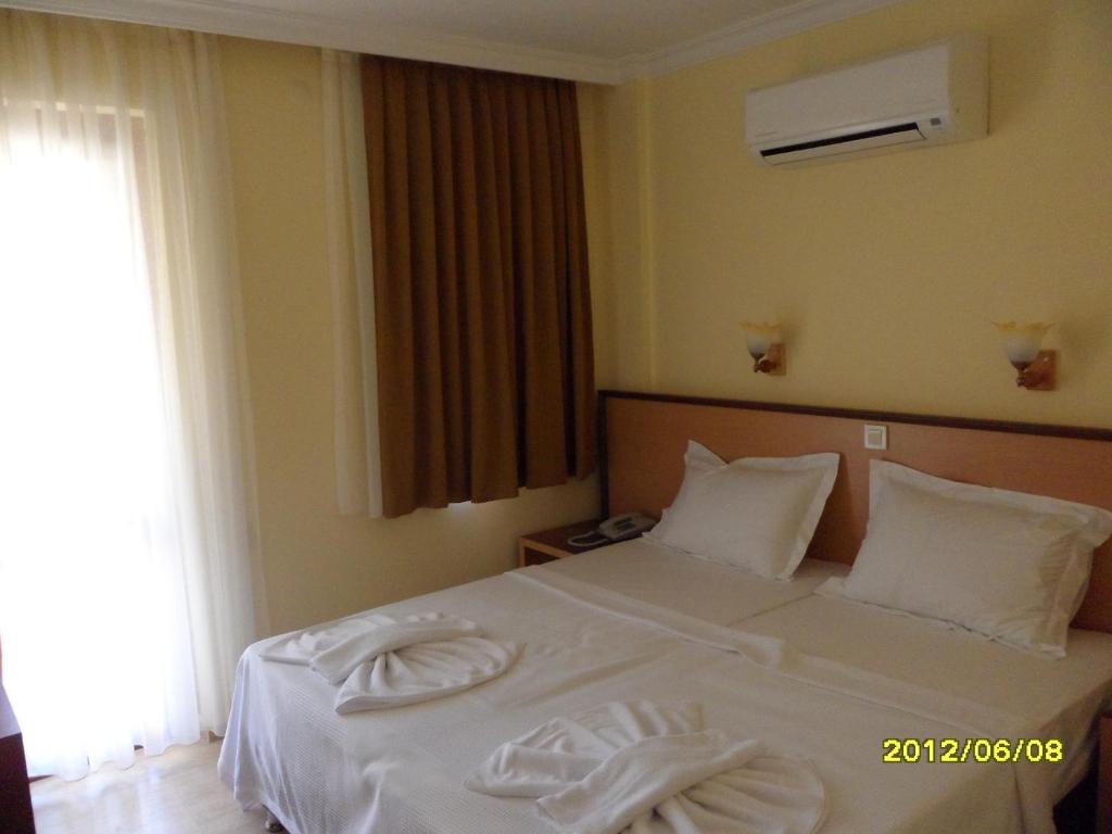 Postel nebo postele na pokoji v ubytování Felice Hotel