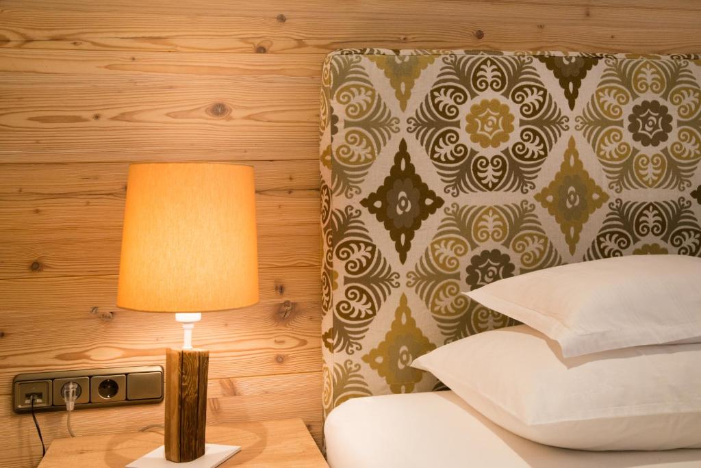 Postel nebo postele na pokoji v ubytování Hotel Garni Glockenstuhl