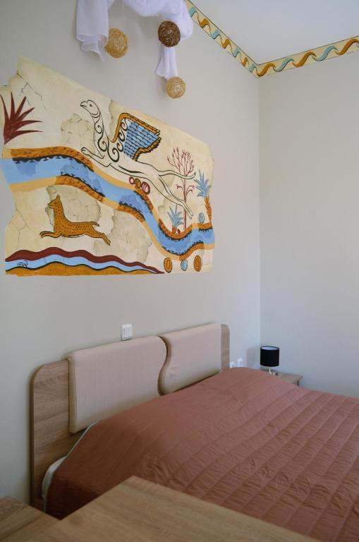 Postel nebo postele na pokoji v ubytování Kafouros Hotel
