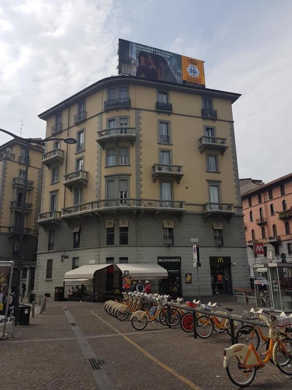 a large building with bikes parked in front of it at Aldebaran in Milan