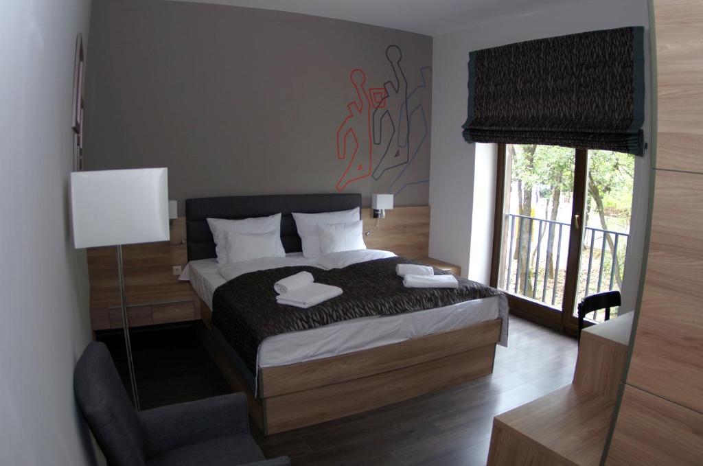 Postel nebo postele na pokoji v ubytování Hotel Therapia