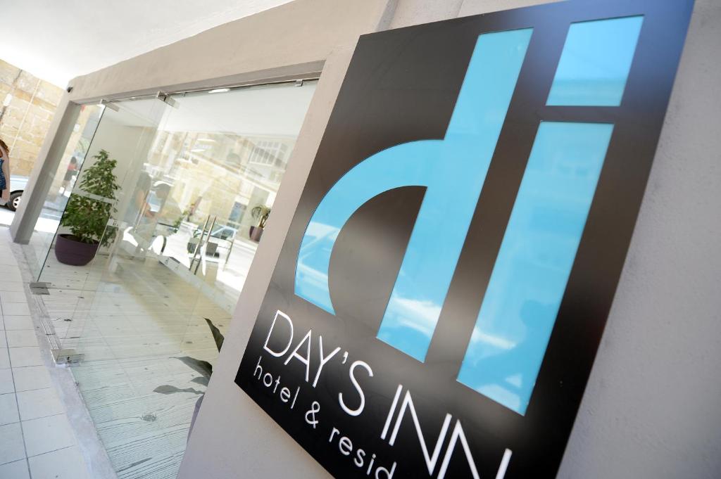 a sign for a days intent hospital and rescue hospital at Day&#39;s Inn Hotel and Residence in Sliema