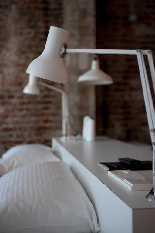 Postel nebo postele na pokoji v ubytování 9Hotel Central