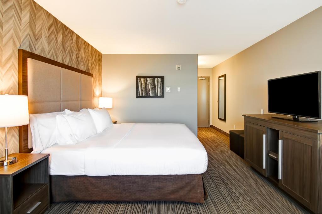 Een bed of bedden in een kamer bij Canalta Brooks