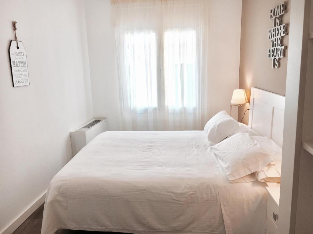 Postel nebo postele na pokoji v ubytování Hotel Carbonell