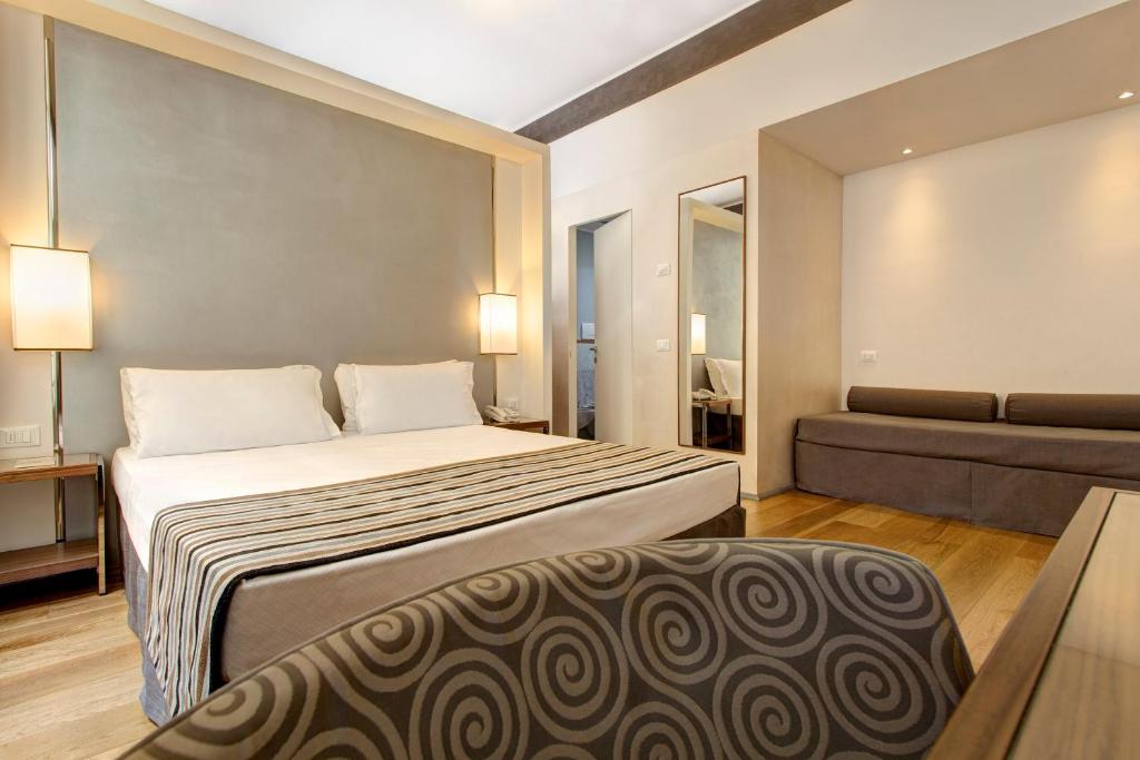 Postel nebo postele na pokoji v ubytování Hotel Orto de' Medici