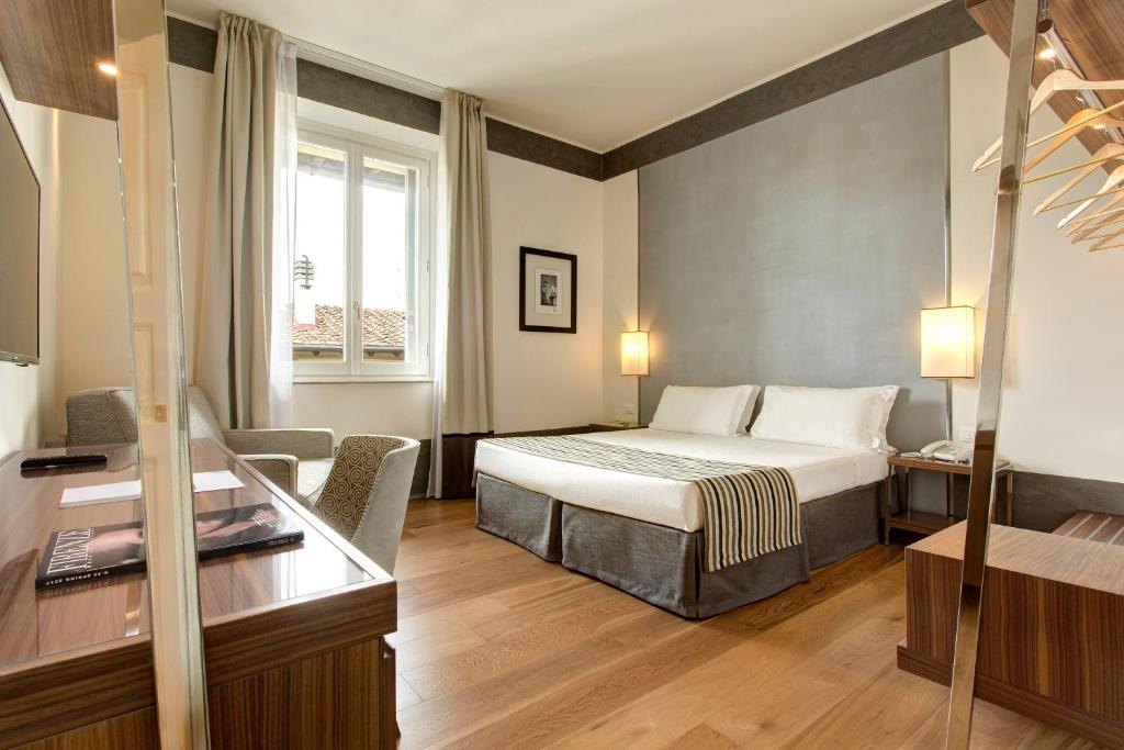 Postel nebo postele na pokoji v ubytování Hotel Orto de' Medici