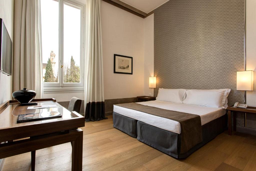 Postel nebo postele na pokoji v ubytování Hotel Orto de' Medici