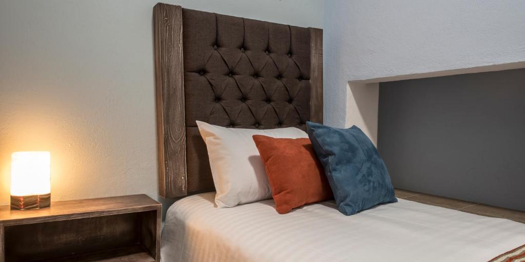 Postel nebo postele na pokoji v ubytování Hotel Casa Aurora