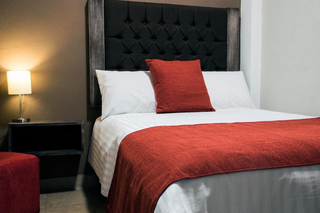 Postel nebo postele na pokoji v ubytování Hotel Casa Aurora