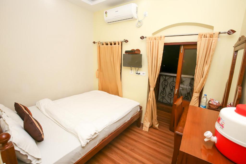 Postel nebo postele na pokoji v ubytování Hotel Cecil