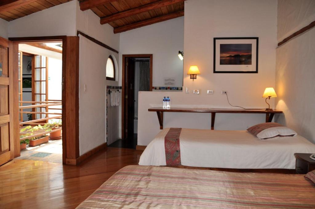 Postel nebo postele na pokoji v ubytování Boutique Hotel Casa Foch