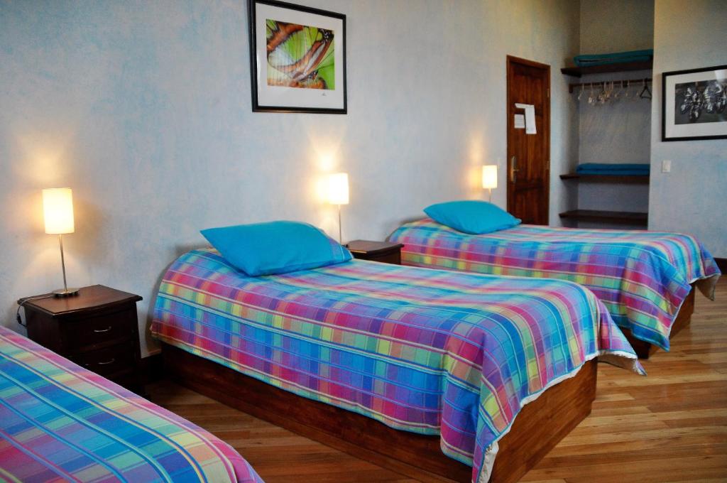 Postel nebo postele na pokoji v ubytování Boutique Hotel Casa Foch