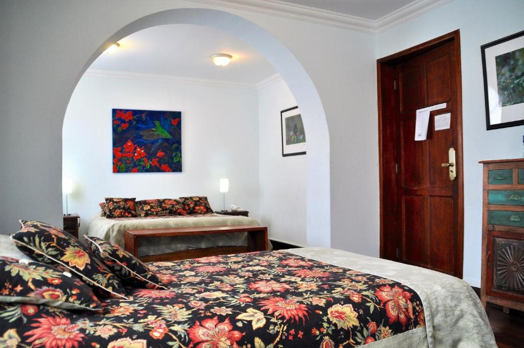 Postel nebo postele na pokoji v ubytování Boutique Hotel Casa Foch