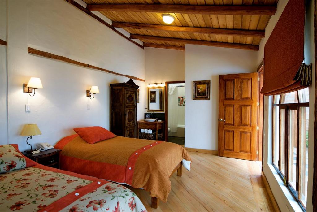 A bed or beds in a room at Boutique Hotel Casa Foch