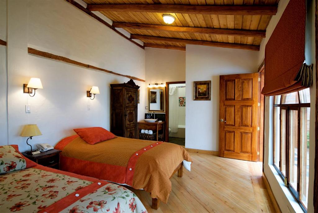 Postel nebo postele na pokoji v ubytování Boutique Hotel Casa Foch