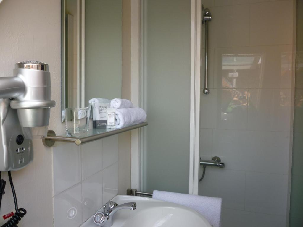 Koupelna v ubytování Hotel Ambrosia
