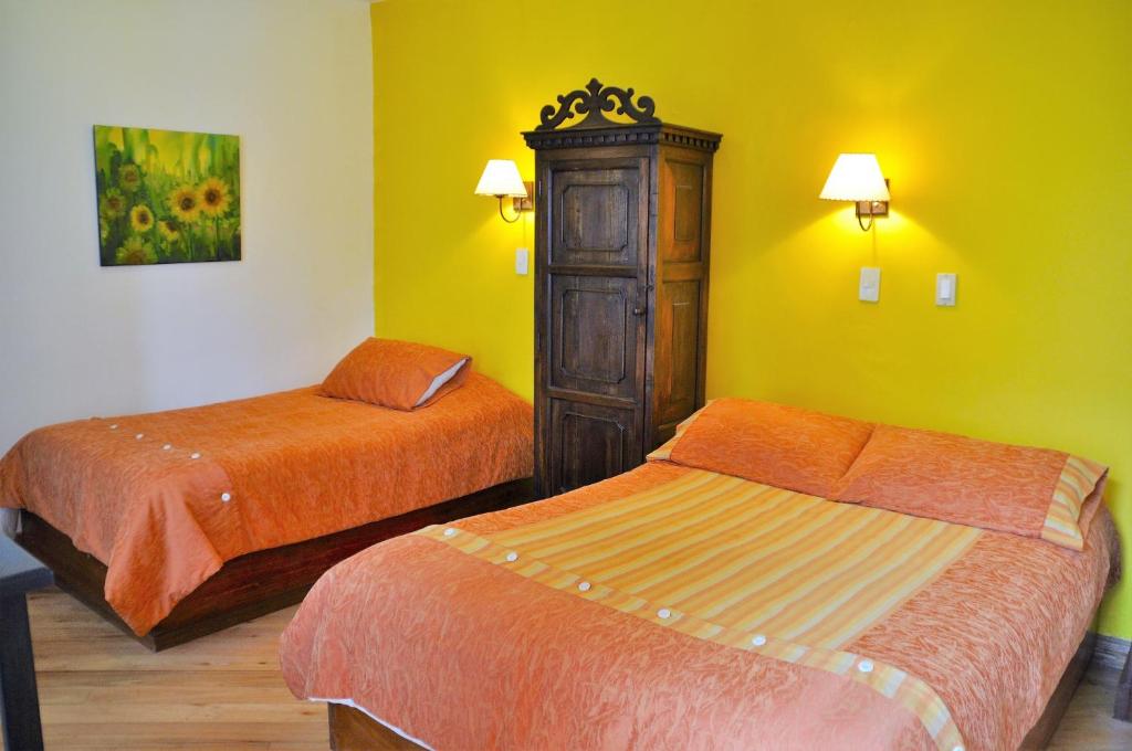 Postel nebo postele na pokoji v ubytování Boutique Hotel Casa Foch