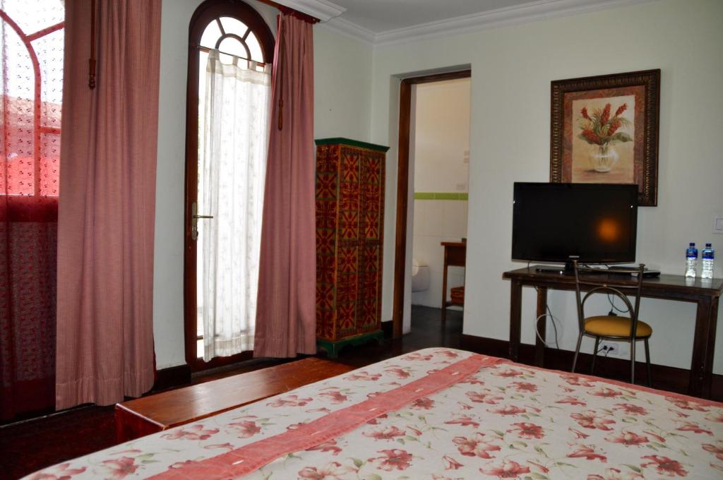 TV a/nebo společenská místnost v ubytování Boutique Hotel Casa Foch