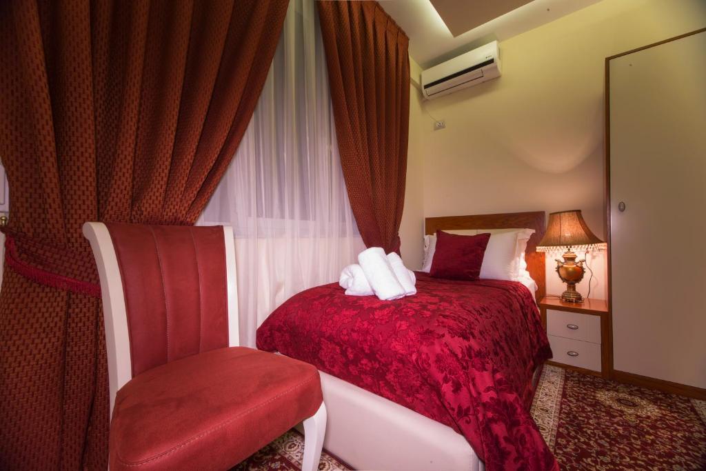 Postel nebo postele na pokoji v ubytování Vila Tako - Hotel