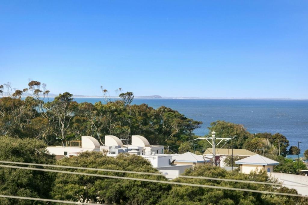 a view of the sydney opera house and the ocean at Whitewater Apartment 101 in Torquay