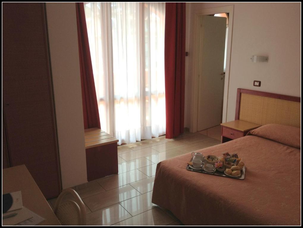Postel nebo postele na pokoji v ubytování Hotel Mistral