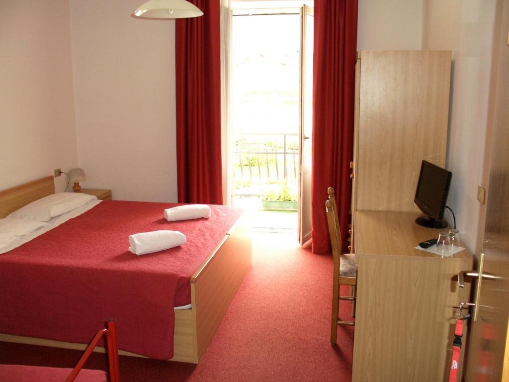 Postel nebo postele na pokoji v ubytování Hotel Bellaria