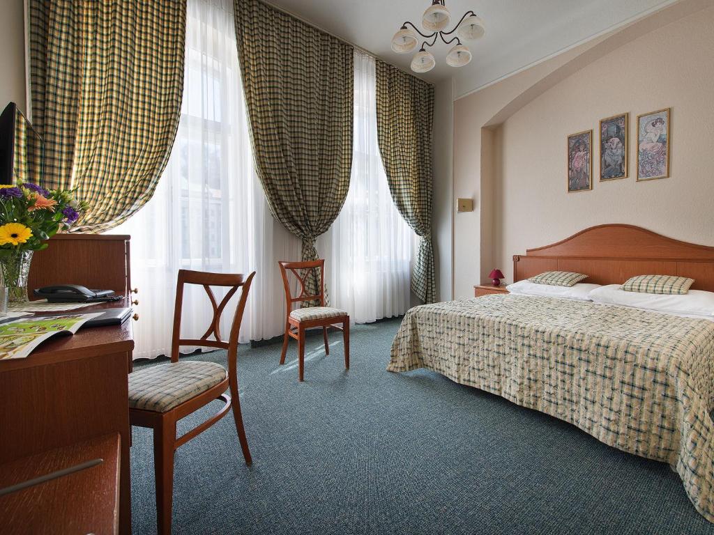 Postel nebo postele na pokoji v ubytování EA Hotel Mozart