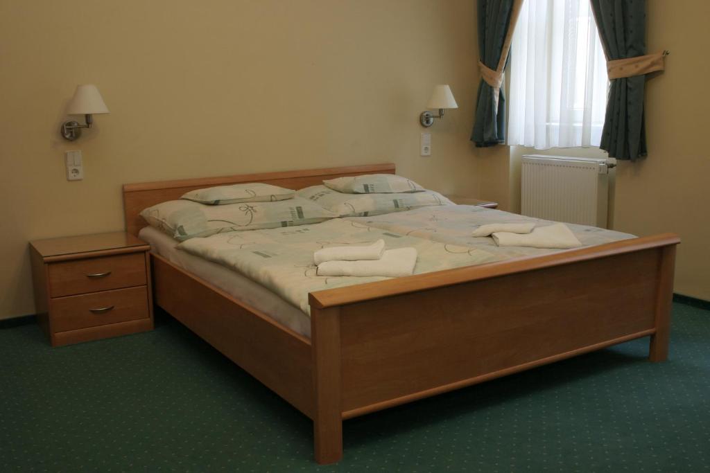 Kuckó Panzió Győrにあるベッド