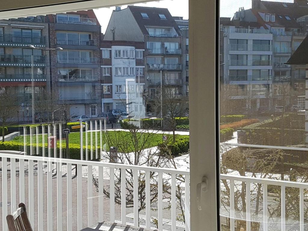a balcony with a view of a city at Appart Noah in Knokke-Heist