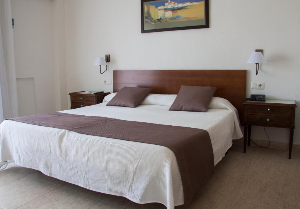Postel nebo postele na pokoji v ubytování Hotel Sicania