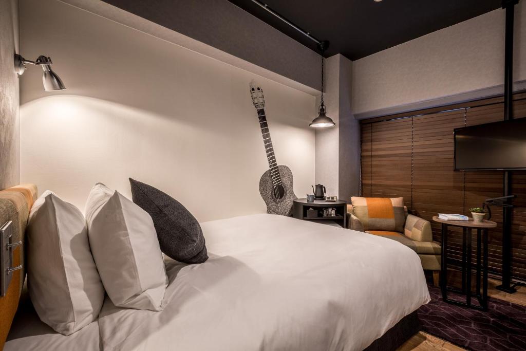 Ліжко або ліжка в номері Hotel Resol Nagoya